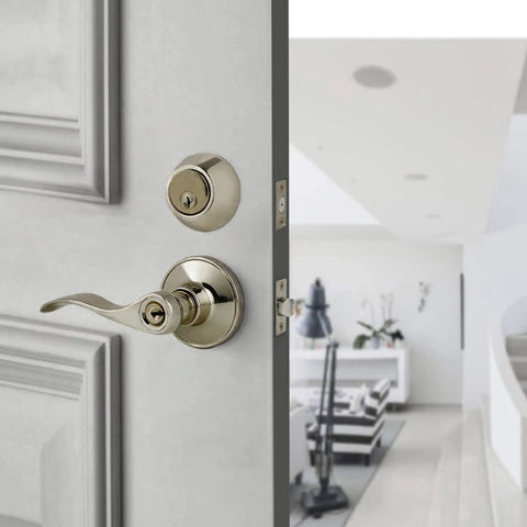 Tustin Series Keyed Alike Entry Lever Lock and Single Cylinder Deadbolt Combo in Antique Brass Finish installed on a door