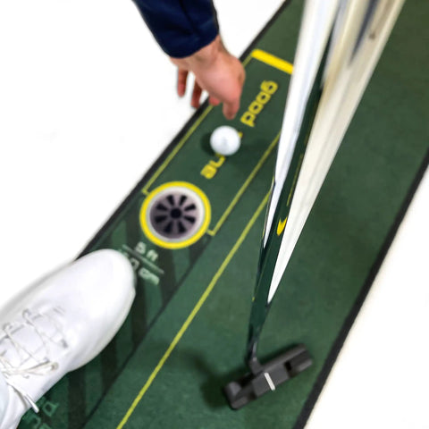 Person using Golf Putting Training Mat 10 Foot Long With Visual Alignment Aids Stroke Amplitude Guide Eye Position Tips