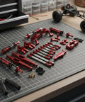 Sick Steel Steering Upgrade Linkage Set For Wltoys 12429 RC Car on workbench, featuring red steel parts and premium shock absorbers.