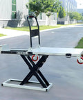 Powerhouse Electric Lift Table Cart With Hydraulic Motorized Platform handles 1100 lbs, shown outdoors with adjustable height.