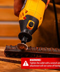 Close-up of Go-To Power Hand Rotary Tool Kit With Variable Speed 8000 To 35000 RPM cutting metal rod with flex shaft attachment.