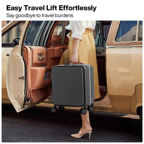 Person lifting Underseat Carry On Luggage 17x14x9 With PC Hard Shell And Aluminum Frame Top Opening Travel Case On Wheels Scratch Resistant Covestro PC Rock Gray No Fuss City Ready Luggage For Quick Trips