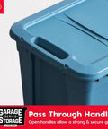 Close-up of navy 31 Gallon Storage Tote. Features snap-on lid and pass-through handles for easy grip, made in USA.