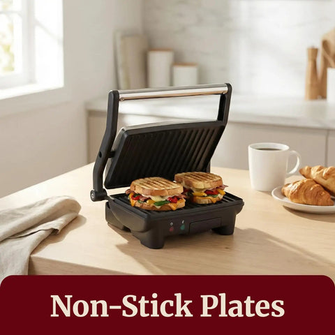 Elite Gourmet EPN-2976 2-in-1 Panini Press & Indoor Grill Made From Durable Stainless Steel cooking two grilled sandwiches.