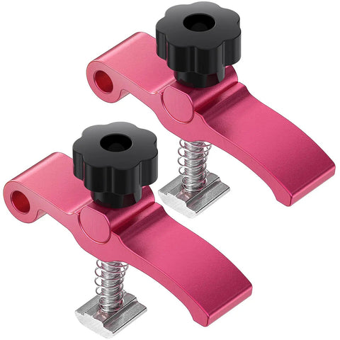 Two Pack T Track Hold Down Clamps For CNC Router And Woodworking Fixturing Aluminum Spoilboard Ready With 6mm Threaded Holes For M6 Nuts Ideal MDF Jigs DIY Projects 80mm Long By 20mm Wide By 60mm High, showing red clamps with black knobs and spring mechanism.