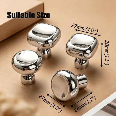 Slick Silver Cabinet Knobs and Drawer Pulls Set, Polished Zinc Alloy With Titanium Coating, square and round knobs on table