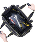 Top view of 17 Inch Tool Bag For Men With Wide Mouth And Waterproof Molded Base showing tools inside, held by handles and strap.