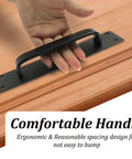 Hand using Two Pack Sliding Barn Door Handle Set In Black 7.9 Inch Aluminum Alloy Door Pull on wooden surface
