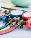 Front view of Hromee AC refrigerant hose set with brass manifold and blue, red, yellow hoses plus gauge dials