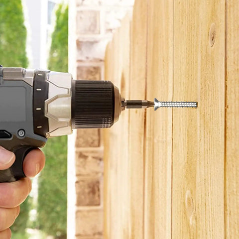 User drilling a #12 gauge 5/8 inch flat head Phillips screw into wood with a drill using 100 Pack Top Shelf Wood Screws.