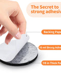 Legit Heavy Duty Felt Furniture Pads 300 Piece Pack Black Self Adhesive Glide Sliders For Hardwood Laminate Tile Floors Bangin Scratch Protection Smooth Ride Floor Savers showing adhesive being peeled from round felt pad.