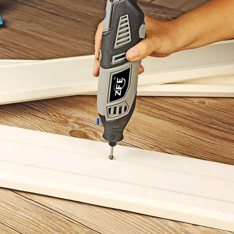 Using Pro Grade Diamond Burr Bits Drill Kit For Rotary Tools 90 Piece Set With One Eighth Inch Shank on wood surface