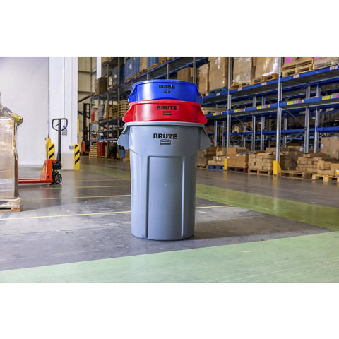 Heavy Duty 44 Gallon Gray Trash Can With Dome Top And Snap Lock Industrial Workhorse Waste Bin Built Rock Solid Stackable Commercial Storage Container Made In Usa in warehouse with red and blue lids.