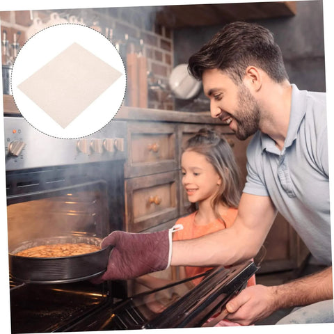 Man using oven with Mica Insulation Sheets for Microwave Oven 10 Pack Heat Resistant Pads, easy to cut for safe kitchen use.