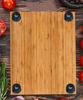 Top Shelf Non Slip Rubber Feet With Stainless Steel Screws, Heavy Duty Anti Skid Bumpers For Countertops And Cabinets, Zero Scratch Drama, Rock Solid Kitchen Savers, 20 Piece Set on a bamboo cutting board.