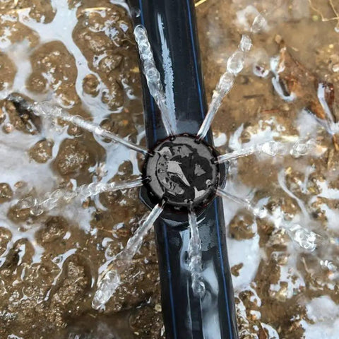 Close-up of 100 Pcs Adjustable Drip Irrigation Emitters Sprinklers For One Quarter Inch Barbed Hose Micro Drip System in action
