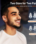 Man wearing high fidelity concert ear plugs for loud music lovers and musicians, silicone reusable earplugs with two size options.