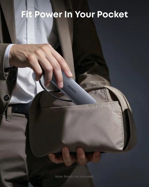 Person placing All In One USB C Hub 7in1 For Laptops And MacBook Type C Devices in a pocket-sized pouch, compact design visible