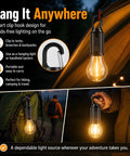 4 Pack Solar Camping Lanterns Portable LED USB Rechargeable Emergency Lights for tents and hiking in dark outdoor setting.