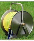 Heavy Duty Stainless Steel Garden Hose Reel With Included 35 Meter Hose mounted on grass, featuring durable stainless steel and hose.