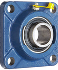 Front view of Beefy Flange Bearing Unit With Four Bolt Mount One And One Eighth Inch Bore Cast Iron Housing Regreasable Set Screw Lock