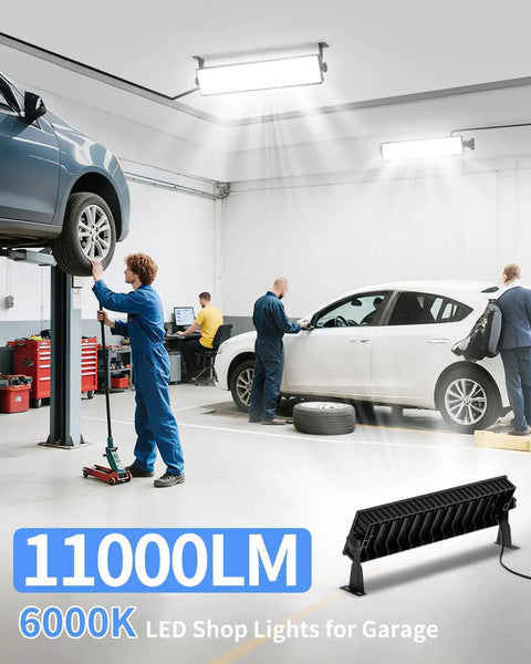 Crazy Bright 100W LED Shop Light Delivers 11000 Lumens Of Daylight 6000K illuminating a garage with vehicles and workers.