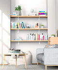 Rock Solid White Floating Shelf Brackets 6 Pack Heavy Duty Steel Wall Mounts 12 Inch supports wooden shelves in a modern living room.
