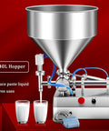 Kickin Performance Pneumatic Bottle Filler Machine With 40L Hopper, stainless steel design, filling liquid into glasses.