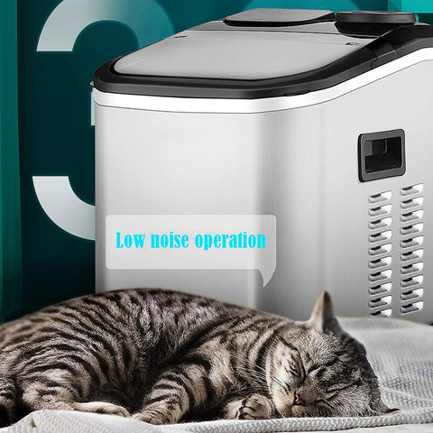 Game Changer Countertop Ice Maker With Self Cleaning Cycle Portable Cube Machine For Kitchen Counters And House Parties Whisper Quiet Low Noise Tech No Drama Operation In Classic Black Or Crisp White beside a sleeping cat.