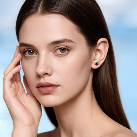 Model wearing Snag Dope G23 Implant Grade Titanium Screw Back Earrings with green zirconia, showcasing lightweight jewelry for sensitive skin.