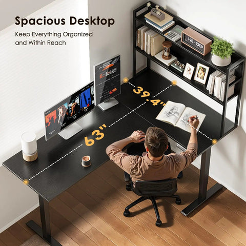 63 Inch L Shaped Electric Standing Desk With Reversible Corner Layout And Hutch Height Adjustable Sit Stand Ergonomic Workstation For Home Office Spacious Large Lift Table Black, top view with man seated and working on dual monitors.