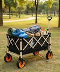 Heavy Duty Outdoor Folding Utility Wagon With 125 Liter Capacity And 600D Oxford Zero Hassle Folding Design shown filled with gear in a park.