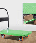 Foldable Flatbed Cart With A Rock Solid Textured Metal Platform And Grippy Four Wheels for moving boxes on a smooth surface.
