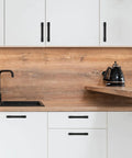 10 Pack 5 Inch Hole Centers Matte Black Cabinet Handles And Drawer Pulls installed in modern kitchen cabinets