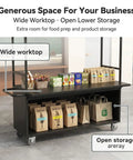 Rock Solid Mobile Vendor Cart With Weather Proof Canopy, Heavy Duty Iron Frame Street Food Stall For City Markets And Festival Grinds with wide worktop and open lower storage.