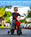 Child riding 12V Kids Ride On Motorcycle with Dual 25W Motors, training wheels, Bluetooth music in park setting