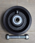 Front view of 4-inch cast-iron V-groove gate caster wheel with bearing and mounting bolt