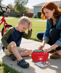 Mother using 196 Piece Waterproof Hard Shell Portable First Aid Kit For Home Car Camping Hiking Travel And Outdoor Adventures With Essential Medical Supplies In Red to treat child's minor injury.