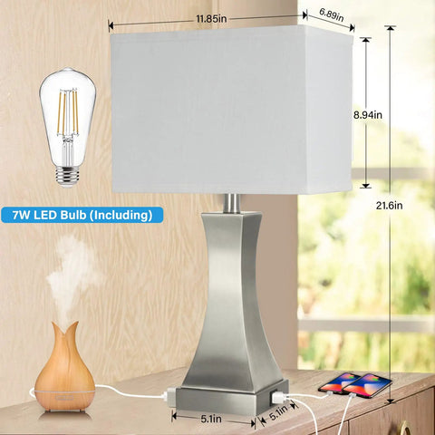 3 Way Dimmable Table Lamp With Touch Control For Bedside Or Desk, Built In USB A And USB C Ports Plus Outlet, 21.6 Inch Tall Nightstand Lamp For Bedroom Living Room Office Or Hotel, Bulb Included with brushed nickel base and linen shade on a table with LED bulb, USB ports, and phone charging.