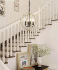 Rustic Wood Four Light Chandelier With Adjustable Suspension Chain in foyer; round sphere with hand painted finish, bronze candle sockets