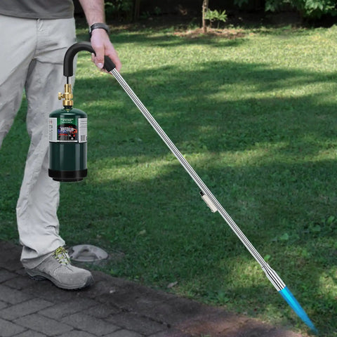 Person using Compact 16.4 Oz Propane Tank Pack Of 2 For Camping Stoves And Torches, fueling torch in outdoor setting