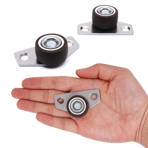 8 Piece Low Profile Mini Caster Wheels Set Side Mount Fixed Rollers Tight Slot Furniture Hack showing small wheels in hand.