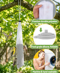 Six Pack Outdoor Sock Feeders For Thistle Seeds with Food Grade Funnels hanging from a tree, with wild finches feeding.