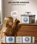 Child and cat looking at Quiet Stainless Steel Cat Water Fountain 2.8L With 20dB Ultra Quiet Pump, LED Water Level Window visible