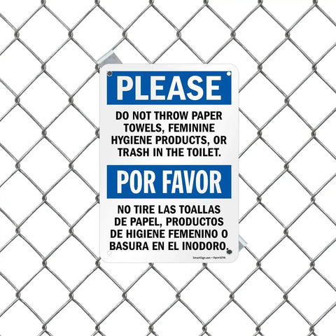 Please Do Not Flush Paper Towels Or Trash In The Toilet Bilingual Sign 7x10 plastic sign on chain link fence