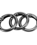 Close-up of three black 300 Pack Mini Round Carabiner Clips One Inch Trigger Spring O Rings for keychains and bags.