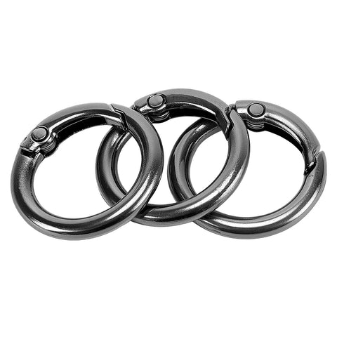 Close-up of three black 300 Pack Mini Round Carabiner Clips One Inch Trigger Spring O Rings for keychains and bags.