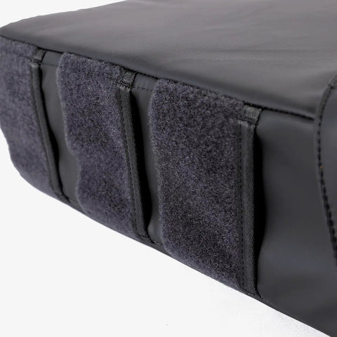Close-up of the rugged exterior of Trasher Vehicle Trash Can For Cars And Trucks, Rugged Modular Utility Bag With Waterproof Lining.