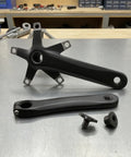 Left And Right 170mm Crank Arm Set For Bikes High Strength Hollow Design Ride-Ready Deformation-Resistant Power Transfer For Riders And Weekend Warriors Durable Aluminum Alloy Build For Mountain Road And Cyclists. black 170mm bicycle crank arms on workbench