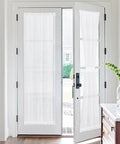 Two Panel Sheer Voile French Door Curtains With Light Filtering, Rod Pocket Window Treatments, installed on patio doors, white, 26x72 inches.